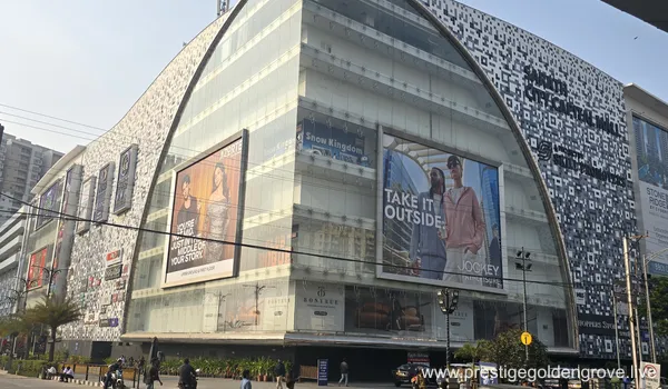 A wide exterior shot of Sarath City Capital Mall in Hyderabad, showcasing the large glass facade and main entrance. Located approximately 9.5 km from Prestige Golden Grove.
