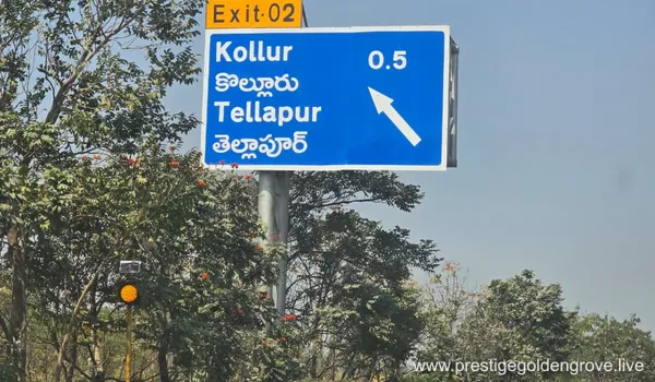 Directional highway sign for Exit 02 toward Kollur and Tellapur, located 0.5 km away, highlighting the excellent connectivity near the Prestige Golden Grove residential project.