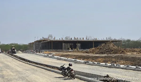 Construction site update of Prestige Golden Grove showing building structure progress and internal road development